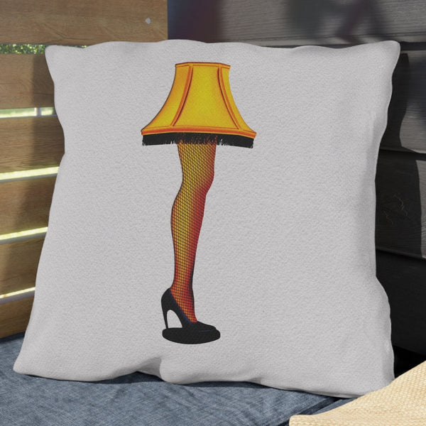 Pillow with a lamp design on a wooden bench outdoors