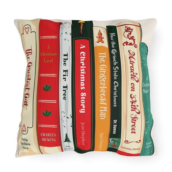 Decorative pillow with book design featuring Christmas-themed titles.