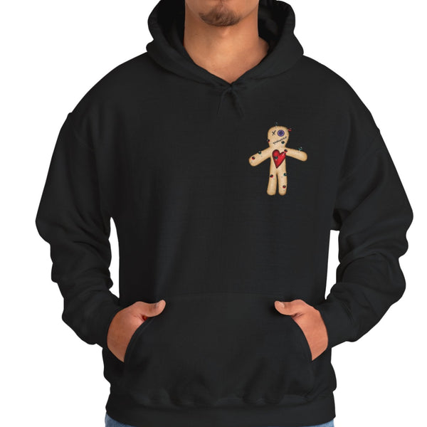 Person wearing a black hoodie with a voodoo doll design on a white background