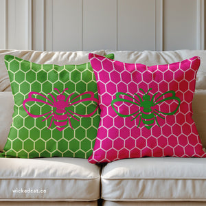 throw pillow with 'Honeycomb Bee Reversible Pink & Green' design