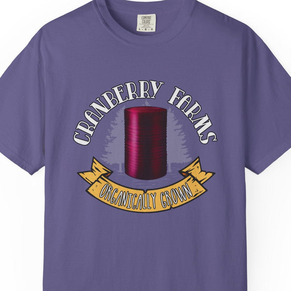 Purple t-shirt with cranberry farm graphic and text on a white background