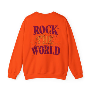 The back of a orange sweatshirt that says Rock the World on a white background.