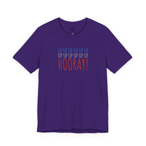 Purple t-shirt with embroidered red white and blue text design on a white background