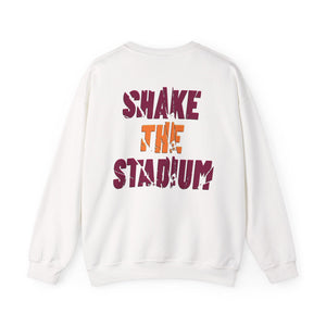 An off-white crewneck sweatshirt shown from the back, featuring a distressed graphic print that reads 'SHAKE THE STADIUM?' in maroon and orange lettering.