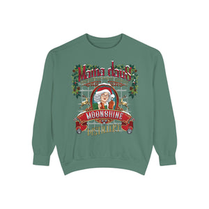 Green sweatshirt with a festive graphic of a woman in a Santa hat and text 'Mama Dow's Moonshine Misadventures' on a white background.