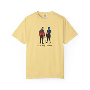 Yellow t-shirt with graphic design of two characters and text on a white background