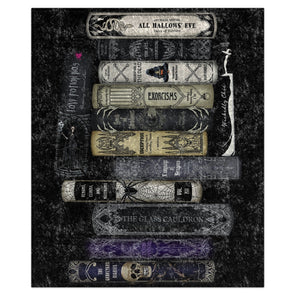 A decorative throw blanket featuring a collection of gothic and horror-themed book spines arranged vertically on a dark, textured background. Titles visible include 'All Hallows Eve', 'Exorcisms', 'The Glass Cauldron', and 'Cult of the Demon'.