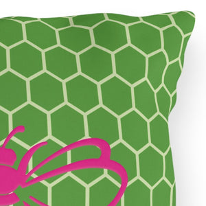 throw pillow with 'Honeycomb Bee Reversible Pink & Green' design
