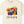 Beige t-shirt with 'Friends' graphic featuring horror movie characters with umbrellas on a white background