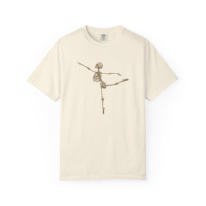 An off-white short-sleeve crewneck t-shirt featuring a graphic of a dancing skeleton in the center, displayed against a solid white background.