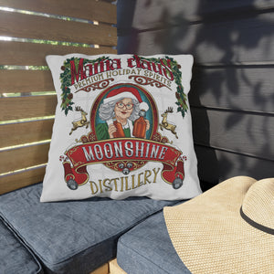 Holiday themed pillow with hand-illustrated design that says Mama Claus Moonshine Distillery