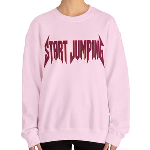 Close up of a pink sweatshirt that says Start Jumping