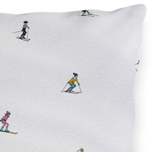 Pillow with skier pattern on a white background