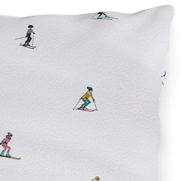 Pillow with skier pattern on a white background