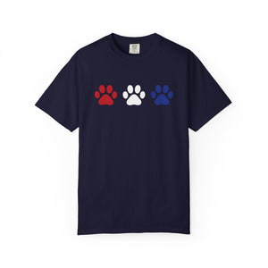 Navy blue t-shirt with red, white, and blue paw prints on a white background