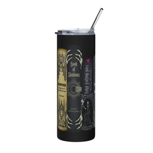 A black insulated tumbler with a clear lid and metal straw, featuring gothic book-themed graphics including 'Book of Shadows' and 'Love Potion No. 09'.