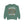 A sage green crewneck sweatshirt featuring a Halloween graphic of a dancing skeleton surrounded by falling autumn leaves, with the text 'IT'S THE MOST WONDERFUL TIME OF THE YEAR'.