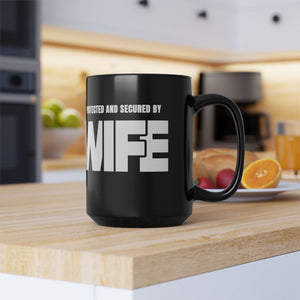 mug with 'Protected By Wife Funny Husband Gift' graphic on a white background