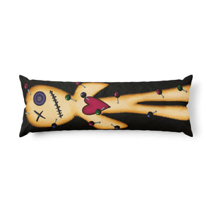 A long rectangular body pillow featuring a stylized stitched doll design in yellow and orange tones with a pink heart, black background, and small colorful accents, shown on a plain white background.
