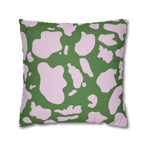 Green pillow with pink camouflage pattern on a white background