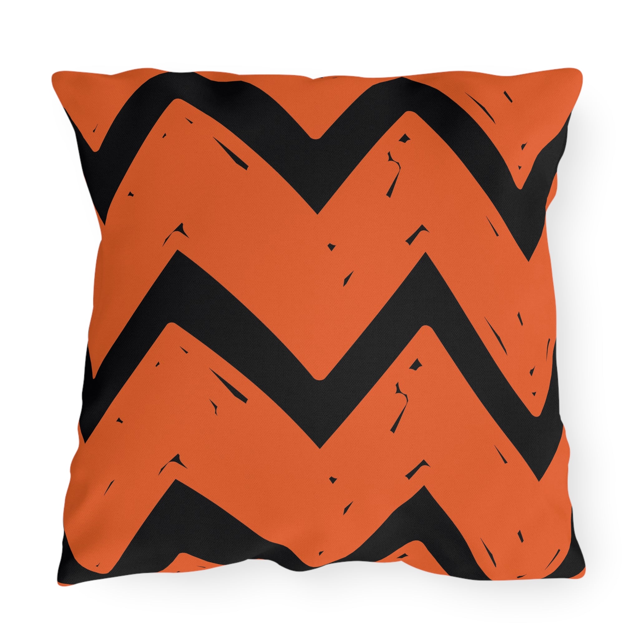 Decorative pillow with orange and black chevron pattern on a white background. Halloween fall indoor outdoor pillow decor.