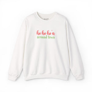 White sweatshirt that reads ho ho ho'n around town in red and green text.