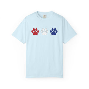 Light blue t-shirt with red, white, and blue paw prints on a white background
