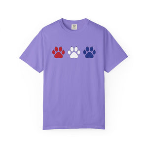 Purple t-shirt with red, white, and blue paw prints on a white background