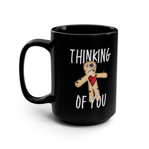 mug with 'Thinking of You Voodoo Doll Funny' graphic on a white background