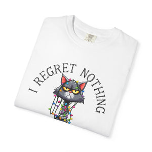 Folded white t-shirt with a cartoon cat tangled in Christmas lights with text at the top that says I Regret Nothing