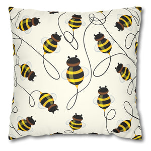 A square faux suede throw pillow cover with a pattern of yellow bees on a white background.