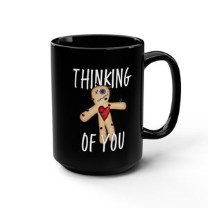 mug with 'Thinking of You Voodoo Doll Funny' graphic on a white background