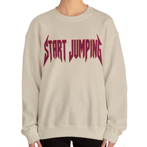 Close up of a tan sweatshirt that says Start Jumping