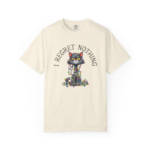 Ivory t-shirt with a cartoon cat tangled in Christmas lights with text at the top that says I Regret Nothing