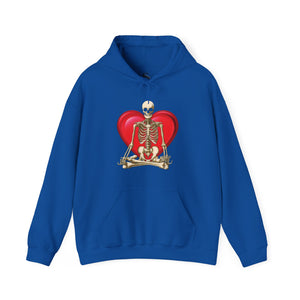 Light pink hoodie with 'Namaste Skeleton Yoga Halloween' design on a plain background
