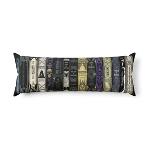 a decorative body pillow with a row of Halloween books design in a white background.