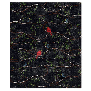 Patterned fabric with red and black birds and branches with snow on a dark blue background