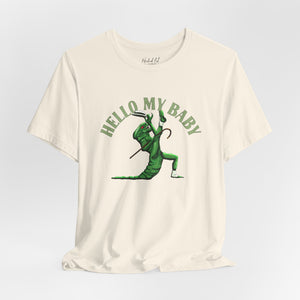 An off-white short-sleeve crewneck t-shirt featuring a green alien dancing, with the text 'HELLO MY BABY' arched above it,, displayed on a light gray gradient background.