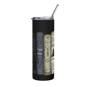 A tall black insulated tumbler with a clear lid and metal straw, printed with illustrated book spines.