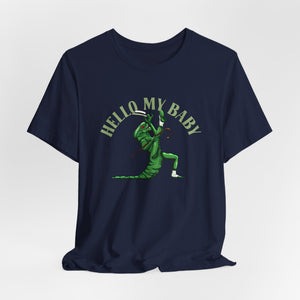 Navy blue short-sleeve crewneck t-shirt featuring a green alien dancing, with the text 'HELLO MY BABY' arched above it, displayed on a light gray background.