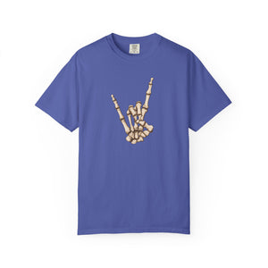 Purple t-shirt with skeleton hand making 'rock on' gesture on a white background