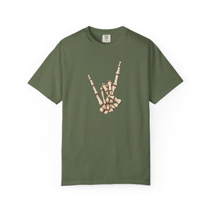 Green t-shirt with skeleton hand making 'rock on' gesture on a white background
