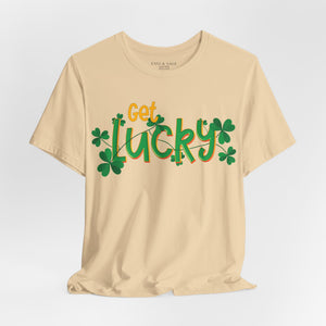 Orange t-shirt with 'Get Lucky Funny St. Patrick's Party' design on a white background