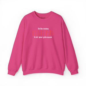 Pink sweatshirt that reads Festivus tis the season to air your grievances.