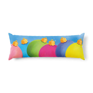 A rectangular lumbar pillow featuring a colorful print of overlapping pastel tree ornaments in pink, blue, green, magenta, and yellow on a light blue background, 