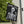 Yard flag and banner with a skeleton holding a martini that says Bone-jour at the top on a black background.