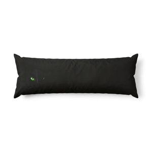 A long rectangular black body pillow featuring a small green cat eye graphic on the left side, set against a plain white background.