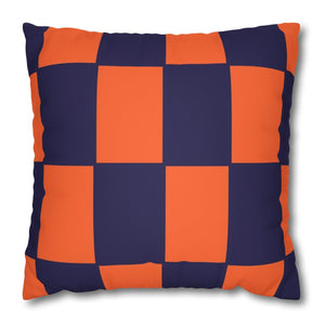 A square faux suede pillow cover with a checkered pattern, alternating between orange and purple colors.