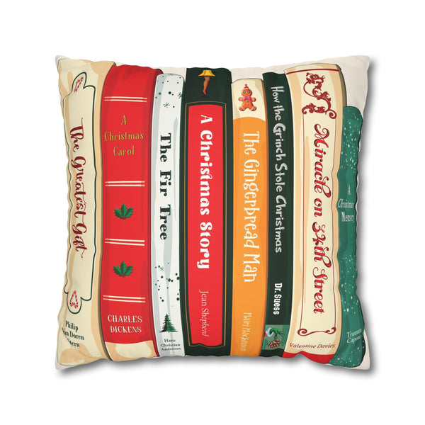 Decorative holiday pillow with book spine designs on a white background