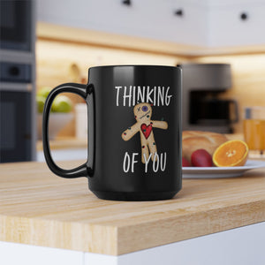 mug with 'Thinking of You Voodoo Doll Funny' graphic on a white background